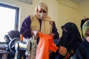 Hands-on guidance helps women build income-generating skills with dignity.