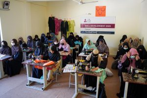 Women gaining tailoring and embroidery skills to support their families.